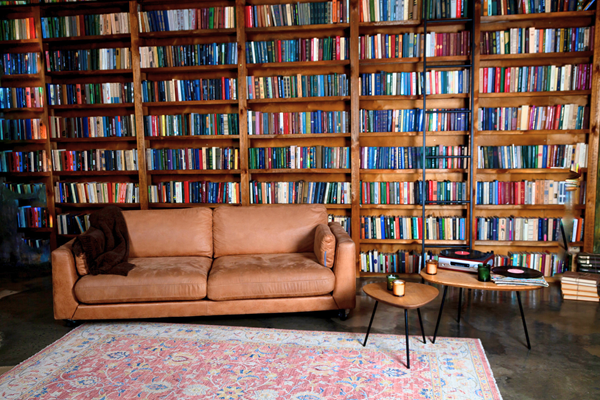 Reading room with bookshelves and a couch